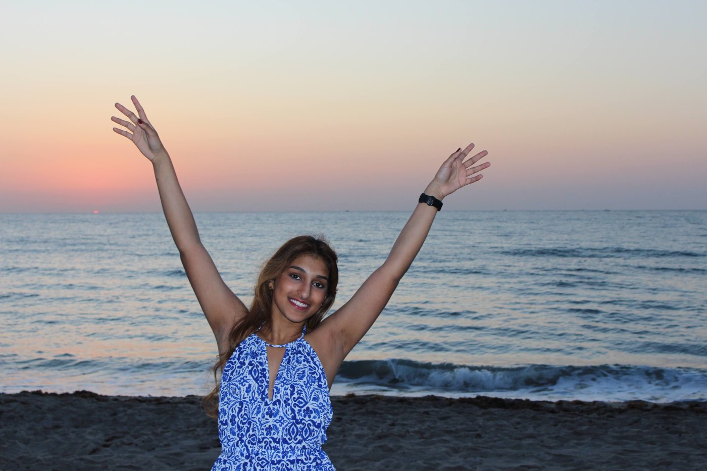 Ava on the beach at sunset