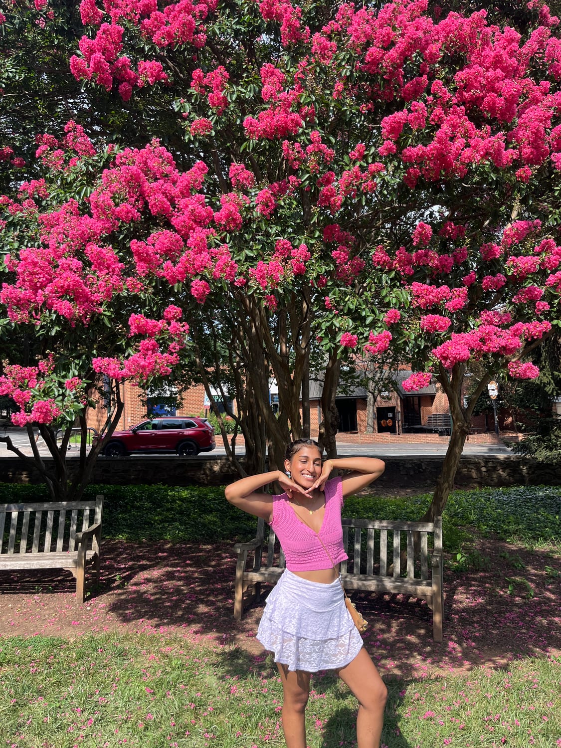 Ava under a blooming crape myrtle in summer