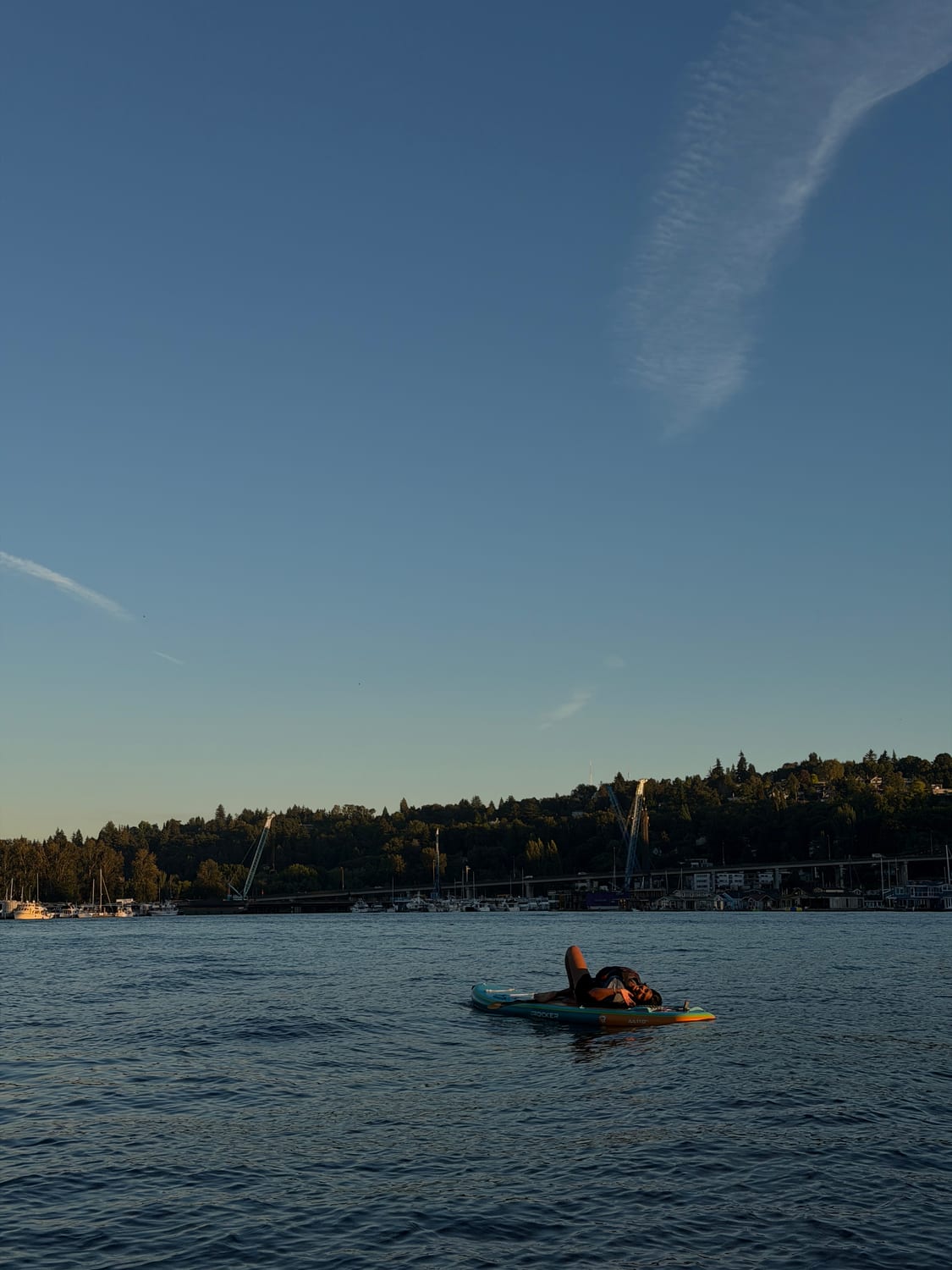 Paddleboarding on a lake at dusk in Seattle