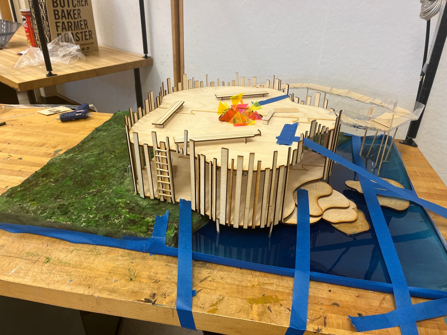 Another in-progress angle showing the slatted facade and the rope ladder, still held with painter's tape.