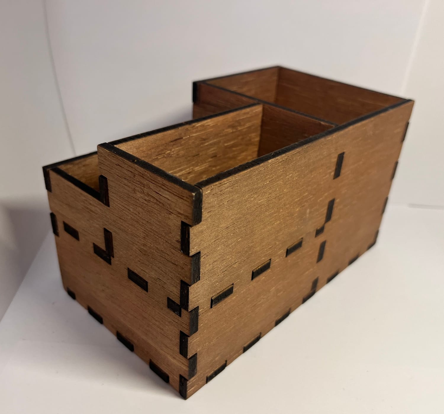 From the back: the finger (box) joints that interlock every wall, laser-cut to slot together.