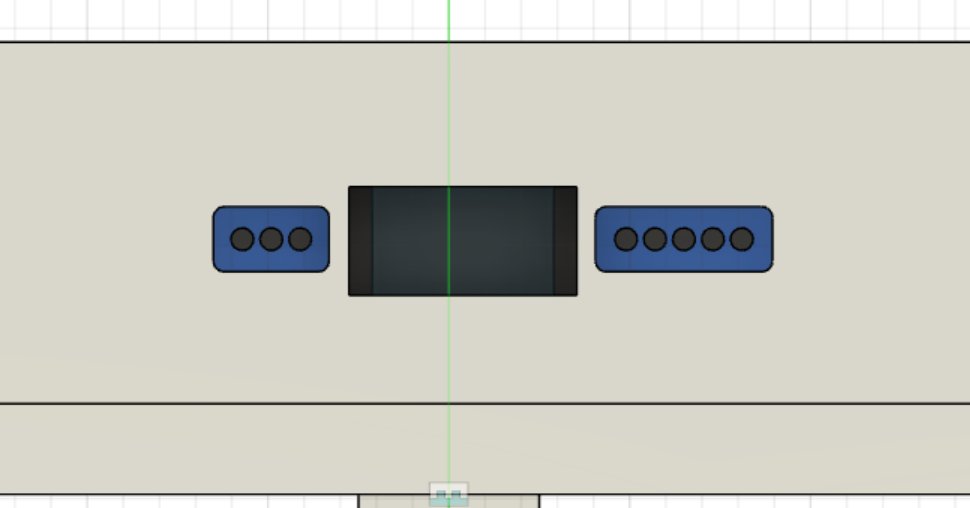 Orthographic view of the cutouts under the charger, speaker, and microphone so the phone stays usable while docked.