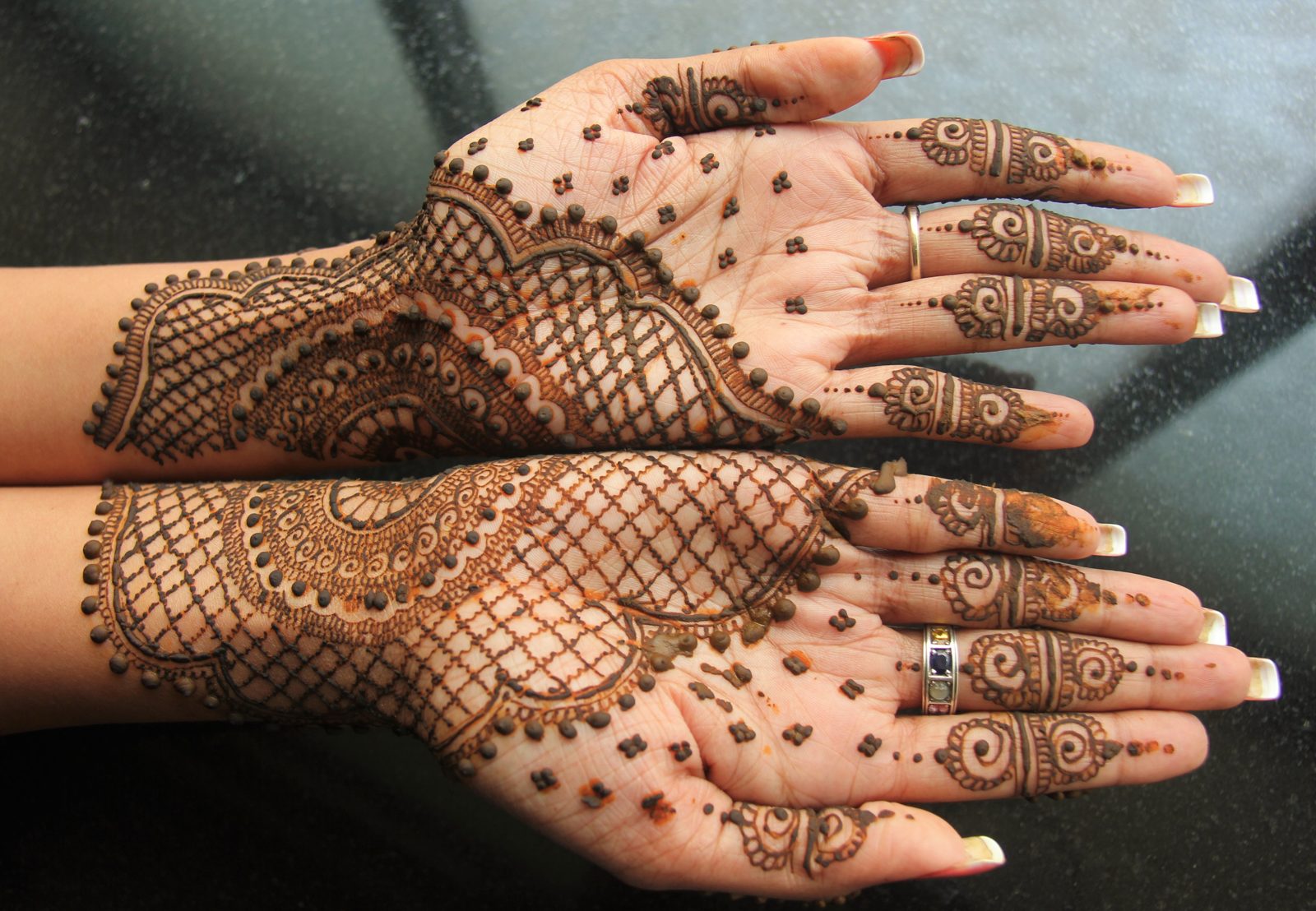 Mehndi — henna applied to the hands — the visual language I drew the lamp's fretwork from.