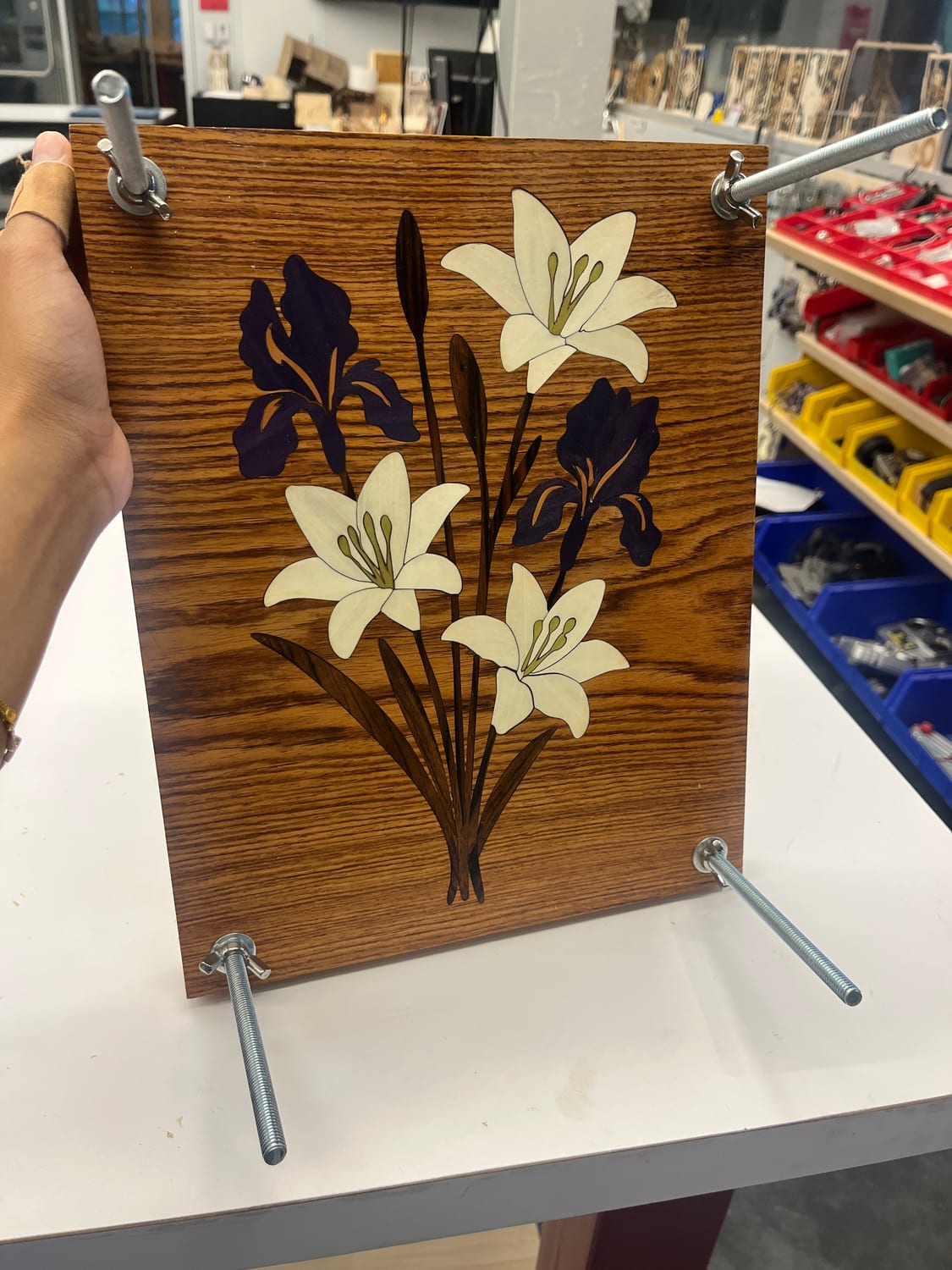 The panel closed up as a working flower press — boards drawn together on threaded rods and wing nuts.