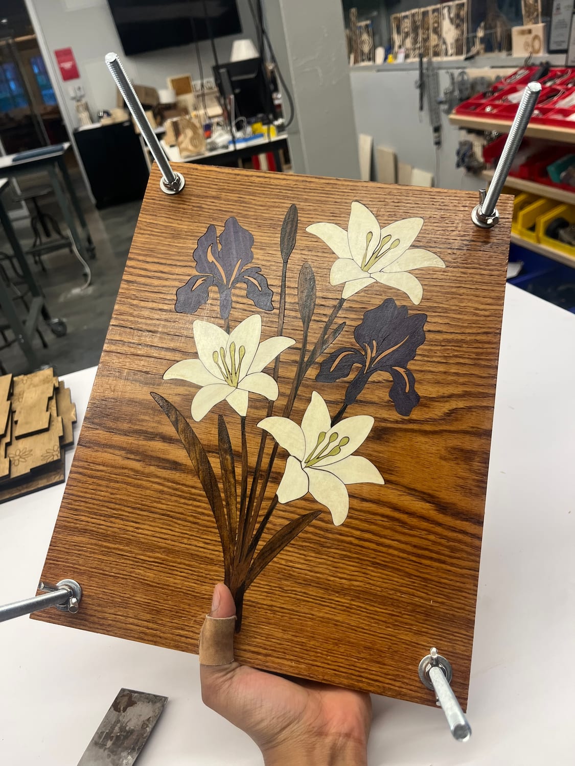 The finished flower-press lid in warmer light, the veneer sealed and the tape long gone.