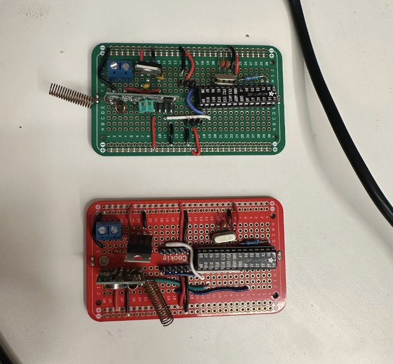 Two soldered perfboard versions of the control board — a green build and a red build — each with the microcontroller and an RF receiver coil.