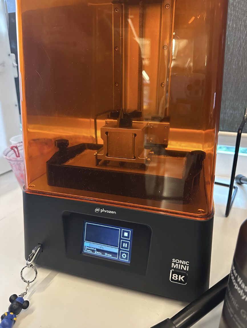 Parts curing on the Phrozen Sonic Mini 8K resin printer.