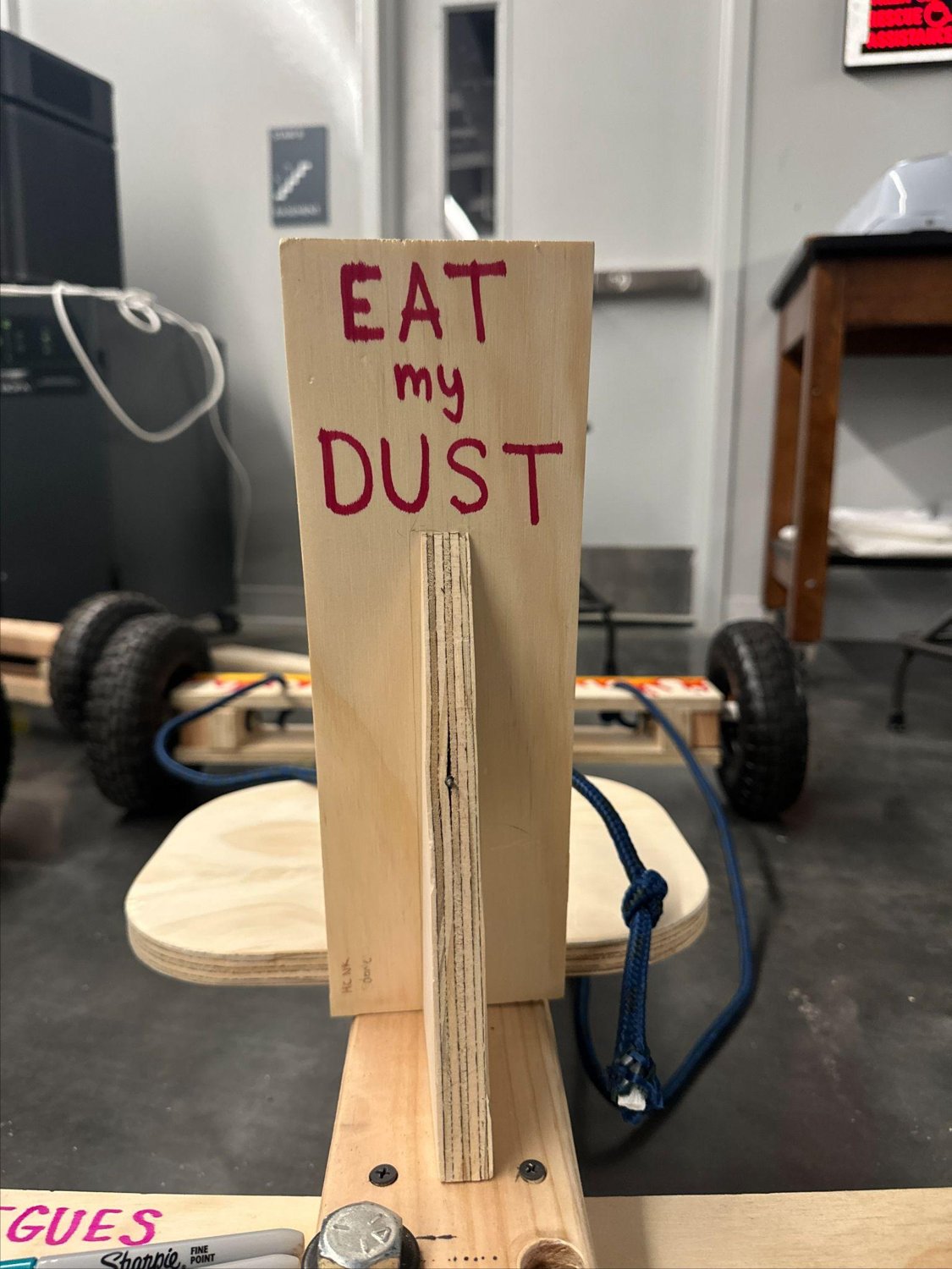 The seat-back: "EAT my DUST."